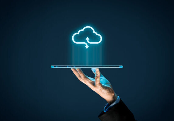 Cloud computing Cloud computing concept - connect devices to cloud. Businessman or information technologist with cloud computing icon and tablet.